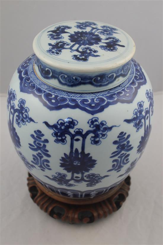 A Chinese blue and white ovoid jar and cover, 19th century, 22.5cm, wood stand